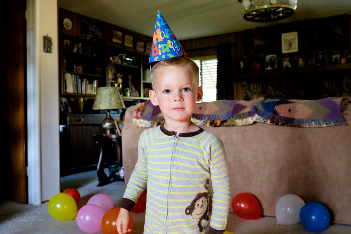 My nephew celebrating his third birthday at Great Grandma Bunny’s house. (23mm f/1.4 @ f/4.0, 1/50, ISO 3200)